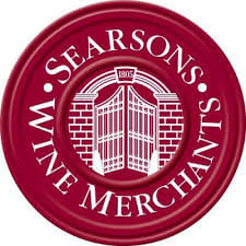 Searsons Wine Merchants circular logo with burgundy background and white building icon in center
